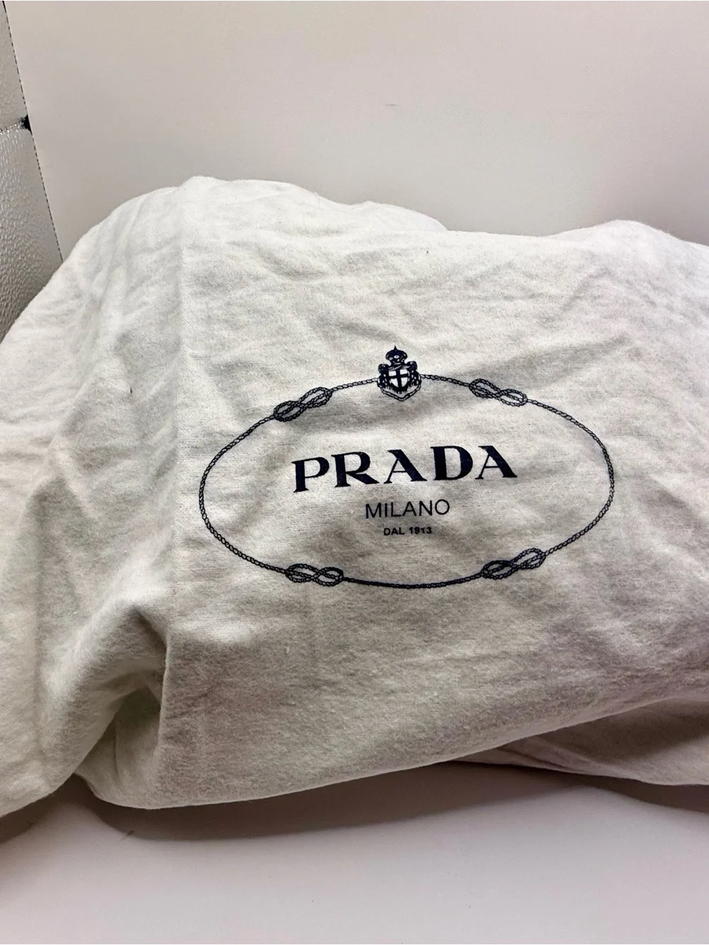 Prada Black Nylon & Leather Bag with Embossed Prada logo.